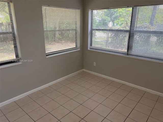 2391 NW 63rd Ter, Sunrise, FL 33313 - empty room with light tile patterned flooring and baseboards