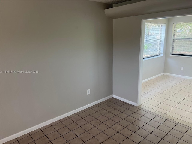 2391 NW 63rd Ter, Sunrise, FL 33313 - tiled empty room with baseboards