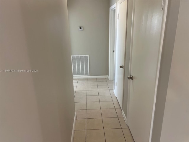 2391 NW 63rd Ter, Sunrise, FL 33313 - hallway with light tile patterned flooring and baseboards