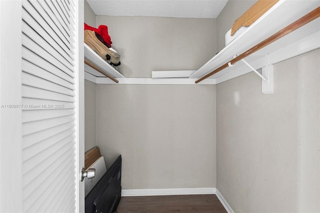 19380 Collins Ave Unit 317, Sunny Isles Beach, FL 33160 - walk in closet with wood finished floors