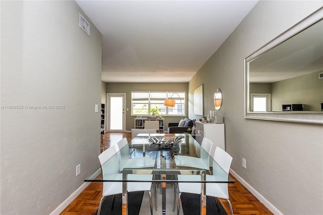 350 S Shore Dr Unit 7, Miami Beach, FL 33141 - dining area with baseboards and a textured wall