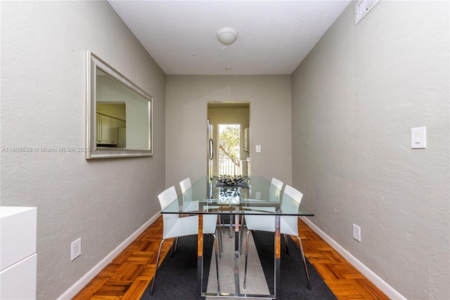 350 S Shore Dr Unit 7, Miami Beach, FL 33141 - dining area with a textured wall and baseboards