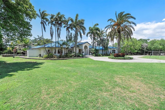 15960 SW 250th St, Homestead, FL 33031 - view of front of house featuring a front lawn and curved driveway