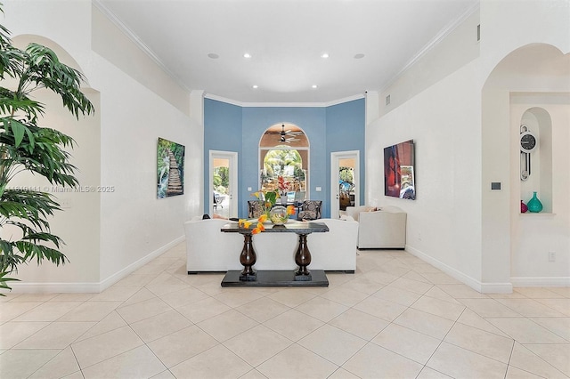 15960 SW 250th St, Homestead, FL 33031 - living room featuring light tile patterned floors, ornamental molding, arched walkways, recessed lighting, and baseboards