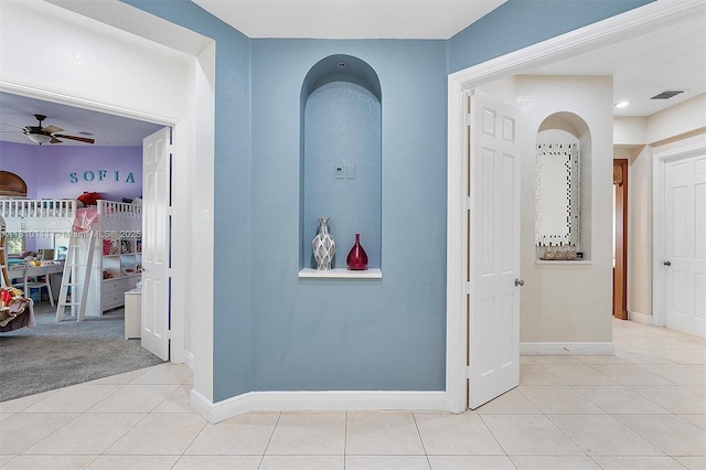15960 SW 250th St, Homestead, FL 33031 - corridor featuring light tile patterned floors, baseboards, and arched walkways