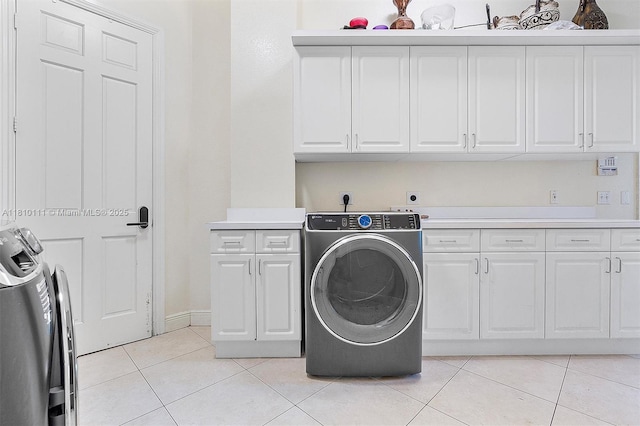 15960 SW 250th St, Homestead, FL 33031 - laundry area with hookup for an electric dryer, cabinet space, light tile patterned floors, and baseboards