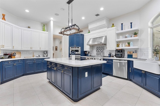 15960 SW 250th St, Homestead, FL 33031 - kitchen featuring appliances with stainless steel finishes, blue cabinets, extractor fan, a sink, and backsplash