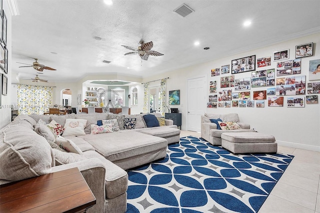 15960 SW 250th St, Homestead, FL 33031 - living room featuring ceiling fan, arched walkways, recessed lighting, light tile patterned floors, and a textured ceiling