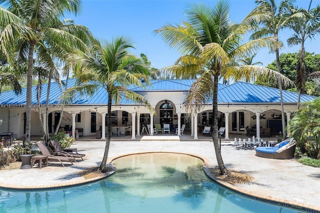 15960 SW 250th St, Homestead, FL 33031 - swimming pool with a patio and french doors
