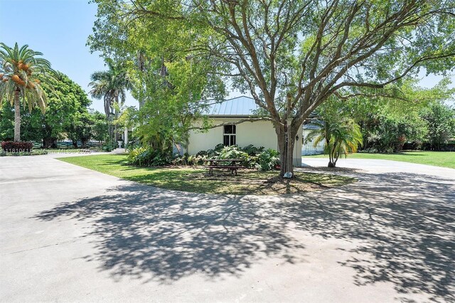 15960 SW 250th St, Homestead, FL 33031 - view of front of home featuring concrete driveway, stucco siding, and a front yard