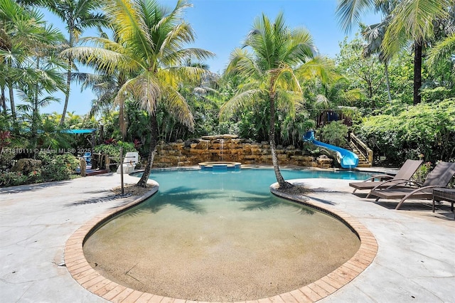 15960 SW 250th St, Homestead, FL 33031 - swimming pool featuring a water slide and a patio area