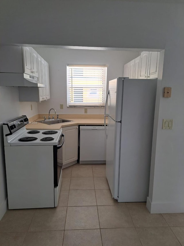 1975 NE 135th St Unit 2D, North Miami, FL 33181 - kitchen featuring white appliances, light tile patterned flooring, and a sink