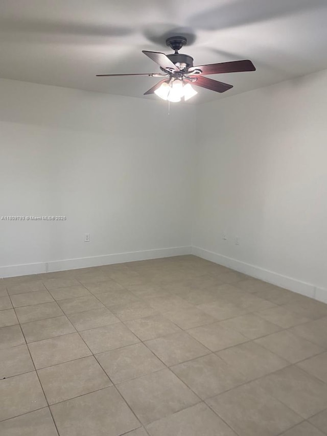 1975 NE 135th St Unit 2D, North Miami, FL 33181 - unfurnished room featuring a ceiling fan and baseboards