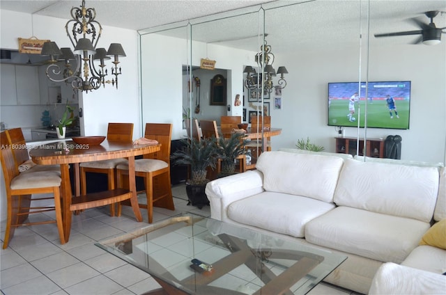 13499 Biscayne Blvd Unit 702, North Miami, FL 33181 - living room featuring a chandelier, a ceiling fan, light tile patterned floors, and a textured ceiling