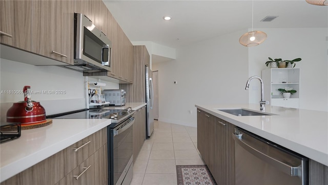 8301 NW 41st St Unit B-404, Doral, FL 33166 - kitchen with stainless steel appliances, a sink, modern cabinets, and light countertops