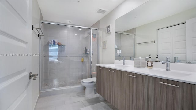 8301 NW 41st St Unit B-404, Doral, FL 33166 - bathroom with double vanity, tile patterned flooring, a stall shower, and toilet