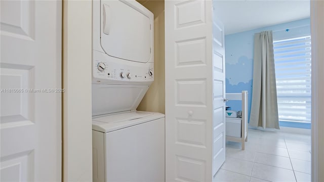 8301 NW 41st St Unit B-404, Doral, FL 33166 - laundry area featuring stacked washer and clothes dryer and light tile patterned floors