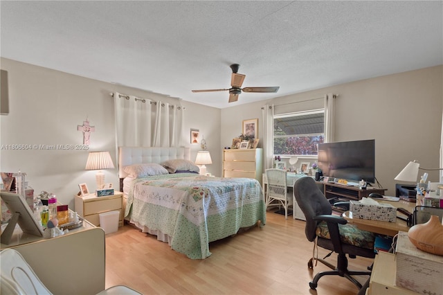 1090 NW 66th Ter, Margate, FL 33063 - bedroom with light wood finished floors, a desk, and ceiling fan