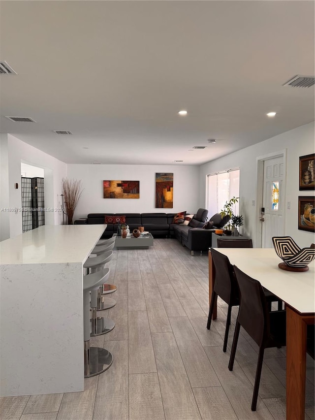 501 SW 18th St, Pompano Beach, FL 33060 - dining space featuring light wood-style flooring and recessed lighting
