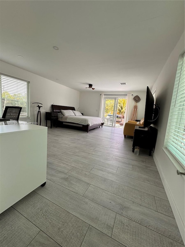 501 SW 18th St, Pompano Beach, FL 33060 - bedroom with wood finished floors and access to exterior