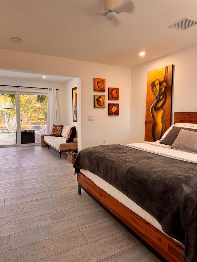 501 SW 18th St, Pompano Beach, FL 33060 - bedroom with wood finished floors, access to exterior, and recessed lighting