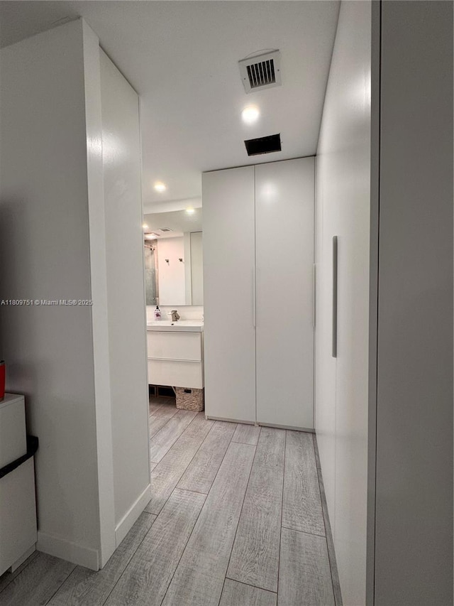 501 SW 18th St, Pompano Beach, FL 33060 - hallway with light wood-style flooring and baseboards