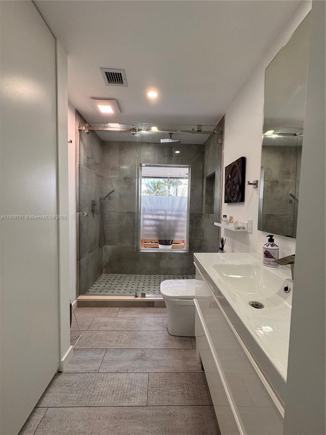 501 SW 18th St, Pompano Beach, FL 33060 - full bathroom featuring a stall shower, vanity, and toilet