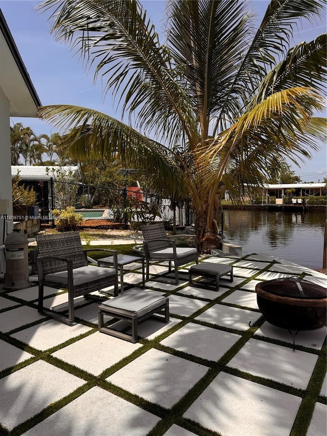 501 SW 18th St, Pompano Beach, FL 33060 - view of patio / terrace featuring a water view and an outdoor pool
