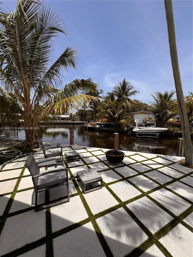 501 SW 18th St, Pompano Beach, FL 33060 - view of patio / terrace featuring a water view and a fire pit