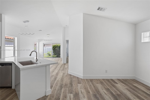 7572 NW 3rd St, Plantation, FL 33317 - kitchen featuring dishwasher, a sink, healthy amount of natural light, and light countertops