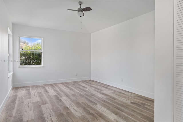 7572 NW 3rd St, Plantation, FL 33317 - unfurnished room with wood finished floors, a ceiling fan, and baseboards