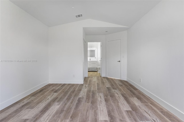 7572 NW 3rd St, Plantation, FL 33317 - unfurnished room featuring wood finished floors, vaulted ceiling, and baseboards