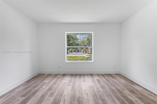 7572 NW 3rd St, Plantation, FL 33317 - spare room featuring wood finished floors and baseboards