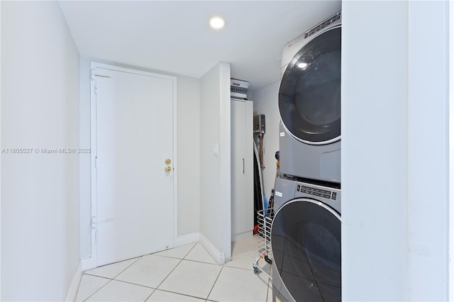 881 Ocean Dr Unit 13H, Key Biscayne, FL 33149 - washroom with estacked washer and dryer, light tile patterned flooring, and recessed lighting
