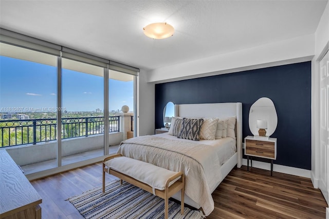 3232 SW 22nd Ter Unit 1106, Miami, FL 33145 - bedroom featuring access to exterior, wood finished floors, floor to ceiling windows, and baseboards
