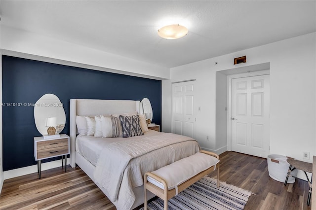 3232 SW 22nd Ter Unit 1106, Miami, FL 33145 - bedroom featuring wood finished floors, a closet, and baseboards