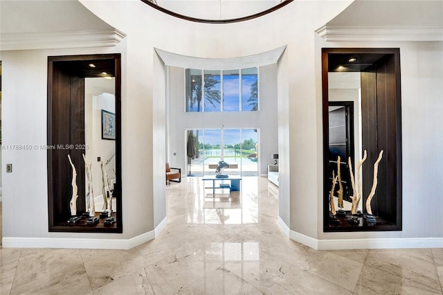 11356 Canyon Maple Blvd, Davie, FL 33330 - hall featuring marble tiled floors, ornamental molding, and baseboards