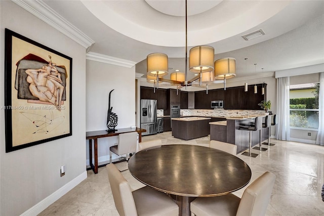 11356 Canyon Maple Blvd, Davie, FL 33330 - dining room featuring baseboards, light marble finish floors, crown molding, and a tray ceiling