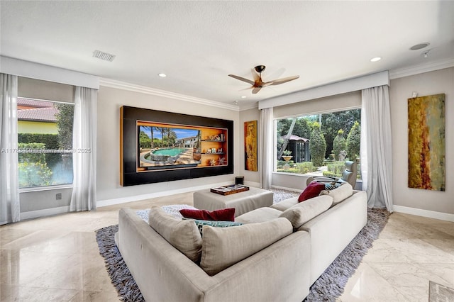 11356 Canyon Maple Blvd, Davie, FL 33330 - living area with healthy amount of natural light, baseboards, ceiling fan, crown molding, and recessed lighting