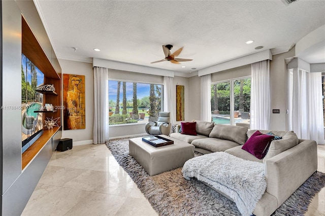 11356 Canyon Maple Blvd, Davie, FL 33330 - living area featuring a ceiling fan, recessed lighting, a textured ceiling, and baseboards