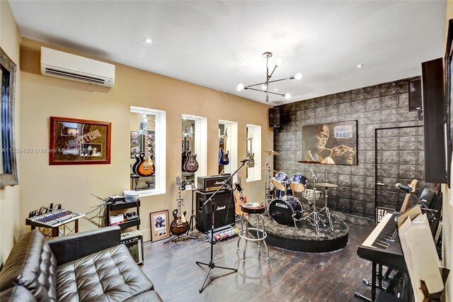 11356 Canyon Maple Blvd, Davie, FL 33330 - living area with a wall mounted air conditioner, wood finished floors, a chandelier, an accent wall, and recessed lighting