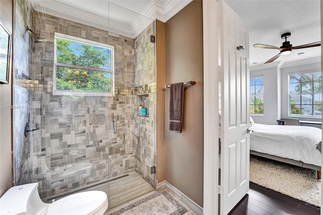 11356 Canyon Maple Blvd, Davie, FL 33330 - bathroom featuring crown molding, a stall shower, ensuite bathroom, toilet, and baseboards