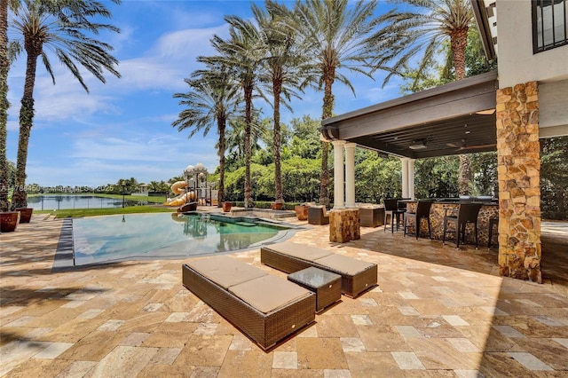 11356 Canyon Maple Blvd, Davie, FL 33330 - outdoor pool with a water slide, a patio area, a playground, and a water view