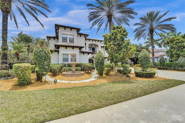 11356 Canyon Maple Blvd, Davie, FL 33330 - mediterranean / spanish-style home featuring stucco siding, a front yard, and driveway