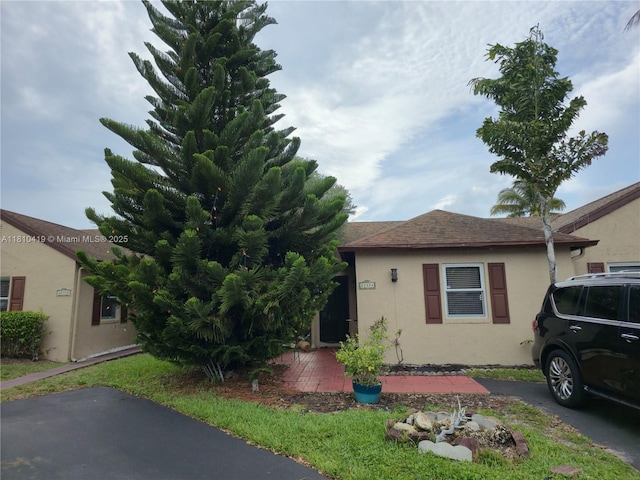 22374 SW 57th Cir, Boca Raton, FL 33428 - view of front of house with stucco siding and a shingled roof