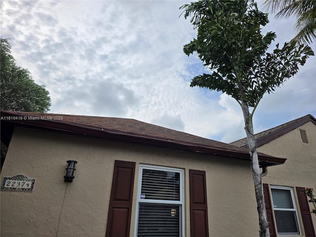 22374 SW 57th Cir, Boca Raton, FL 33428 - exterior view of stucco siding and a shingled roof
