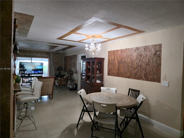 22374 SW 57th Cir, Boca Raton, FL 33428 - dining room with a textured ceiling, a chandelier, a textured wall, and baseboards