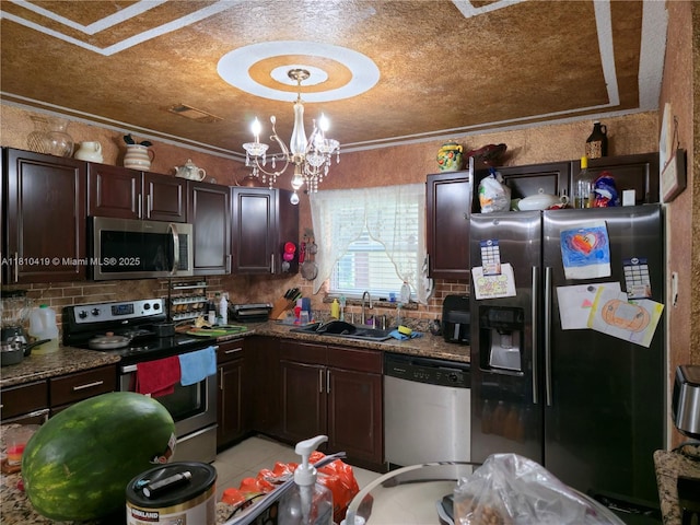22374 SW 57th Cir, Boca Raton, FL 33428 - kitchen with stainless steel appliances, a sink, dark brown cabinets, tasteful backsplash, and ornamental molding