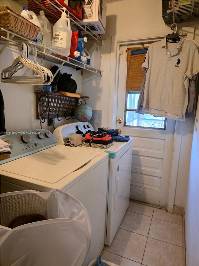 22374 SW 57th Cir, Boca Raton, FL 33428 - laundry area featuring washer and dryer and light tile patterned floors