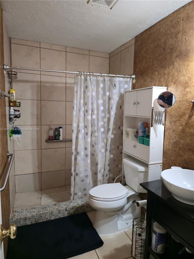 22374 SW 57th Cir, Boca Raton, FL 33428 - bathroom featuring toilet, a stall shower, a textured ceiling, vanity, and tile patterned flooring